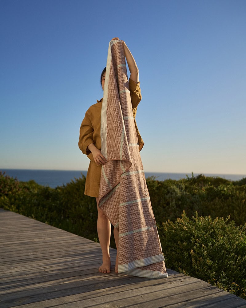Mungo Itawuli Hand Towel in Fired Clay. Cotton beach and bath towels.
