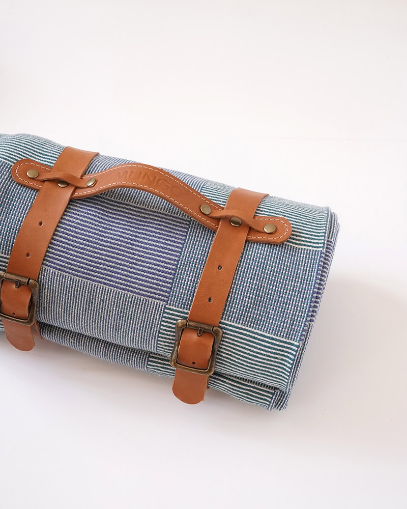 Product view of the Mungo picnic blanket in magpie with strap